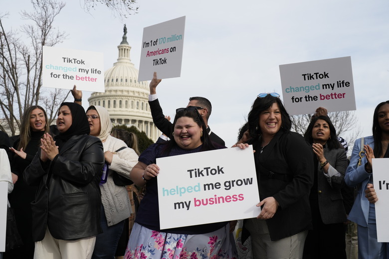 Devotees of TikTok gather at the Capitol in Washington, as the House passed a bill that would lead to a nationwide ban of the popular video app if its China-based owner doesn't sell, Wednesday, March 13, 2024. Lawmakers contend the app's owner, ByteDance, is beholden to the Chinese government, which could demand access to the data of TikTok's consumers in the U.S. (AP Photo/J. Scott Applewhite)