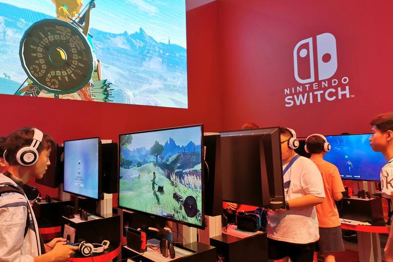 Visitors are seen at a booth of Nintendo Switch at the China Digital Entertainment Expo and Conference, also known as ChinaJoy, in Shanghai, China August 2, 2019.  REUTERS/Pei Li