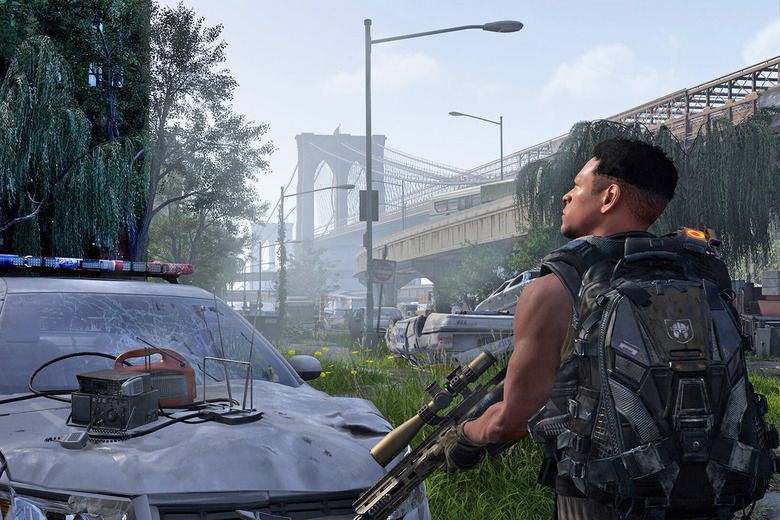 A man with a gun and a military backpack looks upwards with a demolished vehicle, an overgrown urban area and a large bridge in the background. 