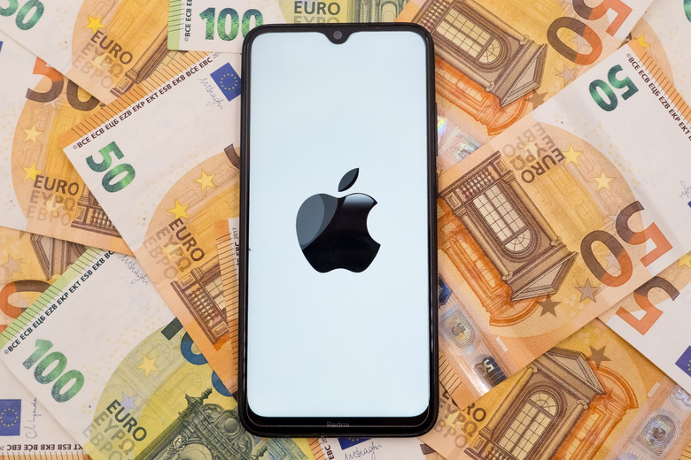 In this photo illustration an Apple logo seen displayed on a smartphone screen on 50 and 100 Euro bills in Athens, Greece on October 9, 2023. (Photo Illustration by Nikolas Kokovlis/NurPhoto via Getty Images)