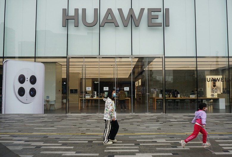 HANGZHOU, CHINA - NOVEMBER 27, 2022 - Customers walk past a Huawei store in Hangzhou, Zhejiang province, China, Nov 27, 2022. Citing national security risks, the US Federal Communications Commission (FCC) on Tuesday banned the sale of communications equipment from Chinese companies such as Huawei and ZTE in the US and banned the use of Chinese-made video surveillance systems, continuing a years-long practice of restricting Chinese technology companies' access to US telecom networks. In addition to Huawei and ZTE, the FCC also named surveillance equipment giants Hikvision and UOB Technology, as well as radio equipment maker Hynengda. (Photo credit should read CFOTO/Future Publishing via Getty Images)