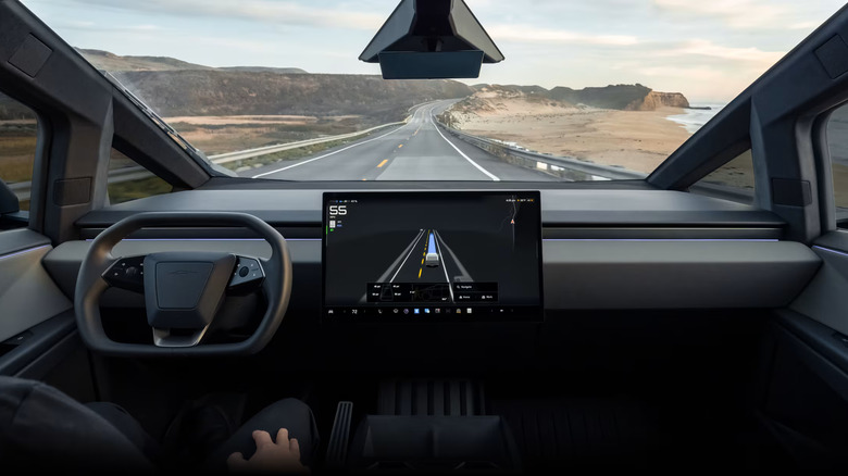A Tesla vehicle using Full Self-Driving on a highway.