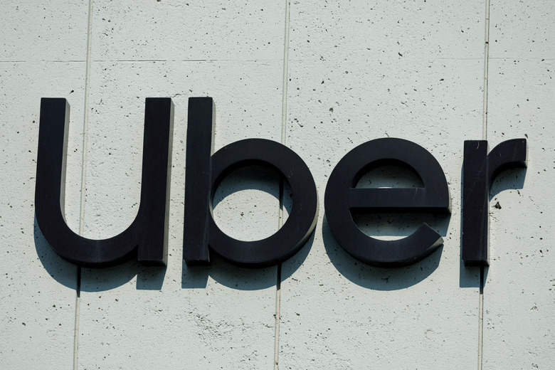 FILE PHOTO: The Uber logo is shown on the building in Los Angeles, California, U.S., February 14, 2024.  REUTERS/Mike Blake/File Photo