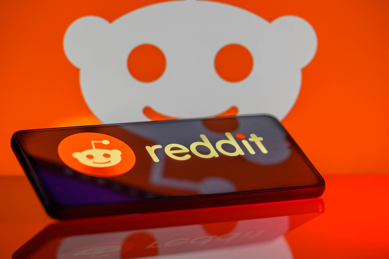The Reddit logo is being displayed on a smartphone with the Reddit icon visible in the background in this photo illustration in Brussels, Belgium, on February 24, 2024. (Photo Illustration by Jonathan Raa/NurPhoto via Getty Images)