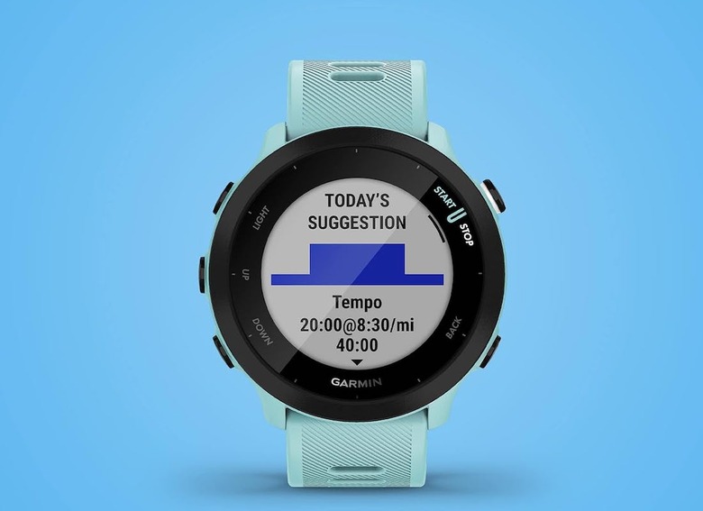 An aqua colored watch faces forward with a workout suggestion on its face. 