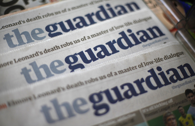 Copies of the Guardian newspaper are displayed at a news agent in London August 21, 2013. British Prime Minister David Cameron ordered his top civil servant to try to stop revelations flowing from the Guardian newspaper about U.S. and British surveillance programmes, two sources with direct knowledge of the matter said. REUTERS/Suzanne Plunkett (BRITAIN - Tags: MEDIA POLITICS)