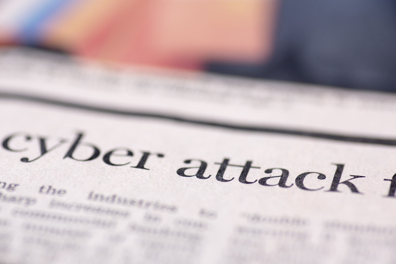 Cyber attack written newspaper, shallow dof, real newspaper.