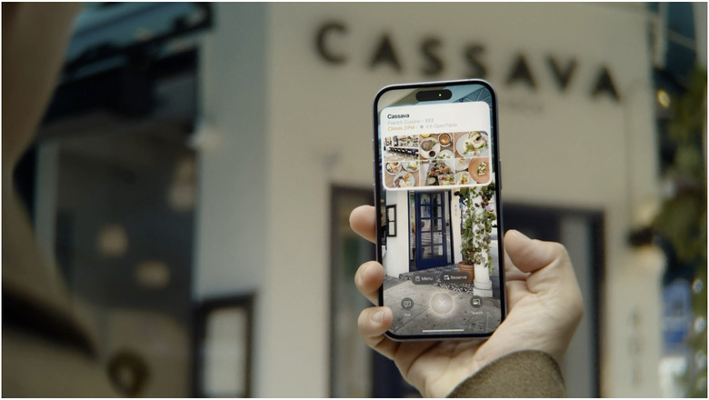 A person using Visual Intelligence on an iPhone 16 to find out information about a restaurant.