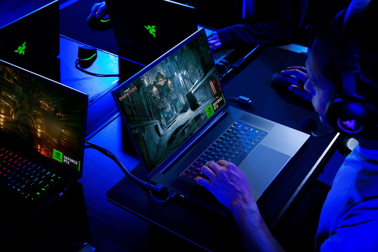 A person playing a game on a Razer Blade 18 laptop.