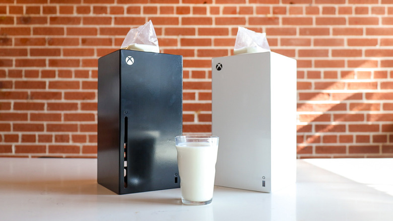Xbox Milk Pitcher in black and white with a glass of milk