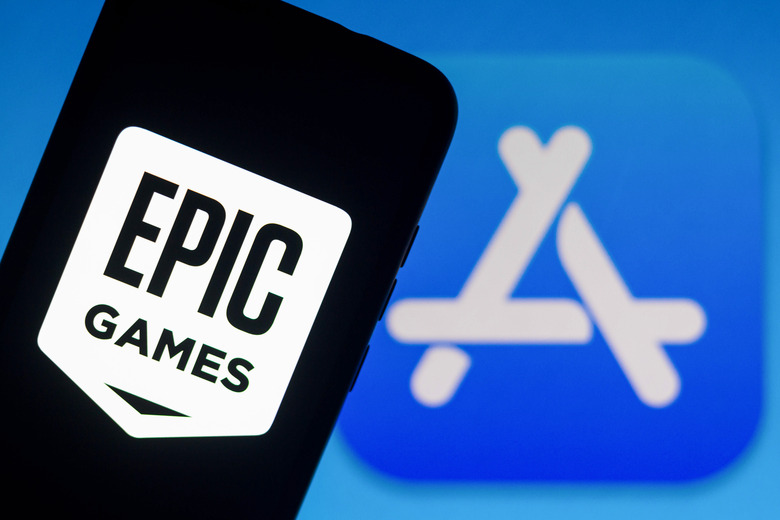 BRAZIL - 2021/09/13: In this photo illustration the Epic Games logo seen displayed on a smartphone with an Apple Store logo in the background. (Photo Illustration by Rafael Henrique/SOPA Images/LightRocket via Getty Images)