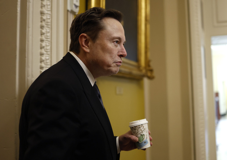 WASHINGTON, DC - DECEMBER 05: Tesla CEO Elon Musk, Co-Chair of the newly announced Department of Government Efficiency (DOGE), arrives on Capitol Hill on December 05, 2024 in Washington, DC. Musk and his Co-Chair, businessman Vivek Ramaswamy are meeting with lawmakers today about DOGE, a planned presidential advisory commission with the goal of cutting government spending and increasing efficiency in the federal workforce. (Photo by Anna Moneymaker/Getty Images)