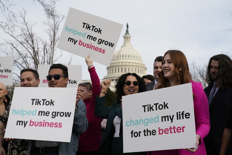 Devotees of TikTok gather at the Capitol in Washington, as the House passed a bill that would lead to a nationwide ban of the popular video app if its China-based owner doesn't sell, Wednesday, March 13, 2024. Lawmakers contend the app's owner, ByteDance, is beholden to the Chinese government, which could demand access to the data of TikTok's consumers in the U.S. (AP Photo/J. Scott Applewhite)