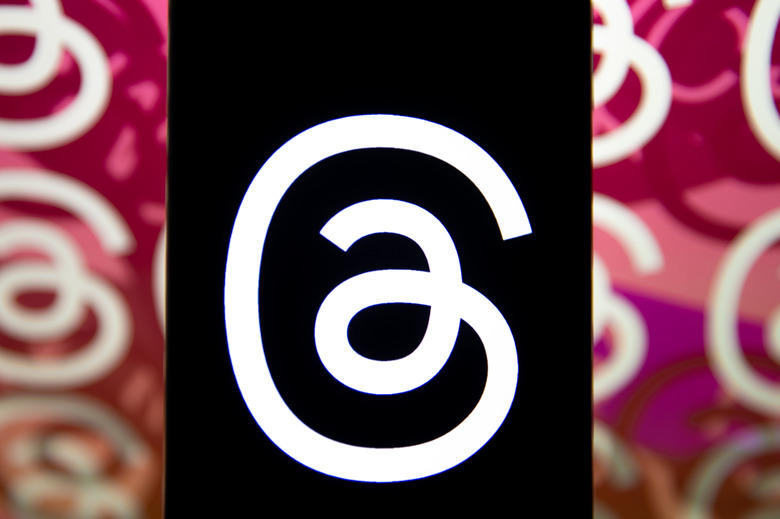 ANKARA, TURKIYE - NOVEMBER 01: In this photo illustration, the logo of Threads is displayed on a mobile phone in front of a computer screen displaying the logo of Threads in Ankara, Turkiye on November 01, 2023. (Photo by Didem Mente/Anadolu via Getty Images)