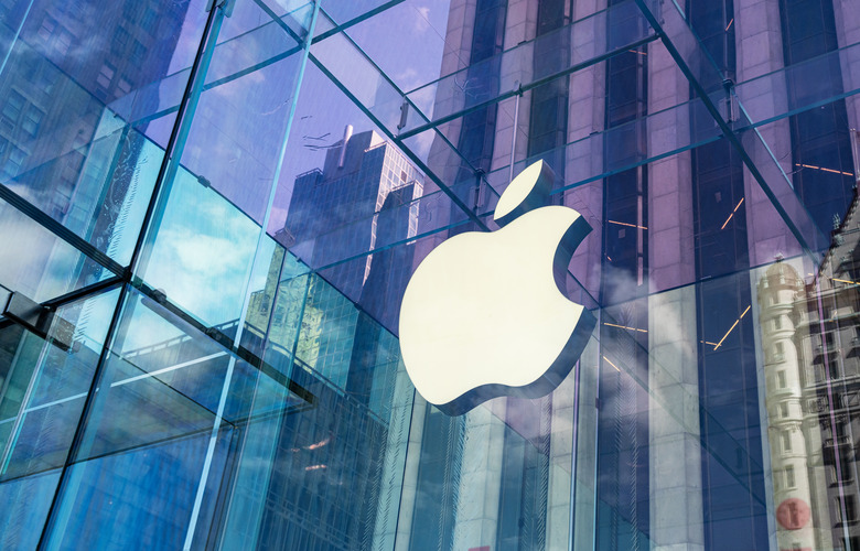 New York City, United States - September 27, 2016: Glass building of the Apple Store with huge Apple Logo at 5th Avenue near Central Park. The store is designed as the exterior glass box above the underground display room
