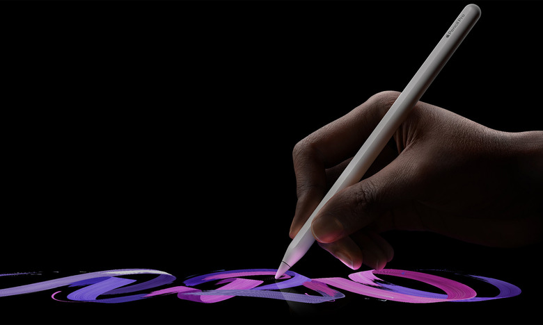 A hand draws on an iPad with the Apple Pencil Pro