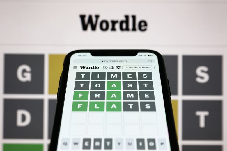 Wordle game displayed on a screen and Wordle game displayed on a phone screen are seen in this illustration photo taken in Krakow, Poland on July 20, 2023. (Photo by Jakub Porzycki/NurPhoto via Getty Images)