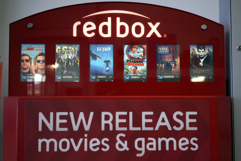 A Redbox video rental machine is seen at a Walmart in Broomfield, Colorado November 24, 2014. Outerwall Inc hiked prices for renting movies and video games at its Redbox kiosks to help fund improvements in its business as streaming sites reduce demand for DVDs. The cost of renting a DVD will increase to $1.50 per day from $1.20, while rental rates for Blu-ray discs will rise to $2 from $1.50, starting Dec. 2. The daily rental rate for video games will go up to $3 from $2 from Jan. 6.  REUTERS/Rick Wilking (UNITED STATES - Tags: SOCIETY BUSINESS ENTERTAINMENT)
