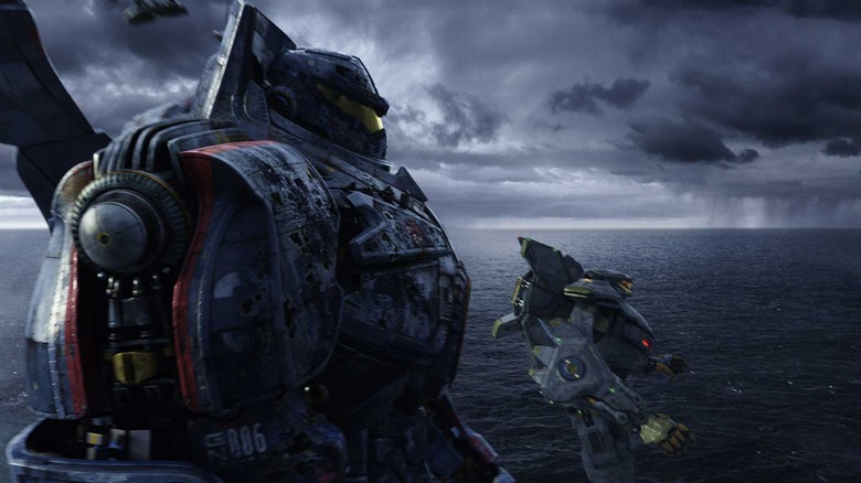 Two Jaegar mechs being dropped in the ocean from Pacific Rim.