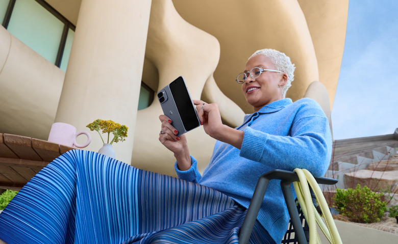 A smartphone/tablet being used by a lady.