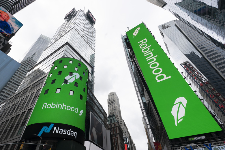 FILE - Electronic screens in New York's Times Square announce the Robinhood IPO, July 29, 2021. (AP Photo/Mark Lennihan, File)