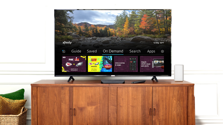 A TV with an Xfinity programming bar visible on the bottom.
