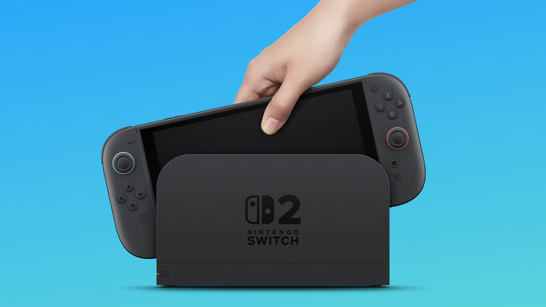 A Switch 2 being lowered into its dock.