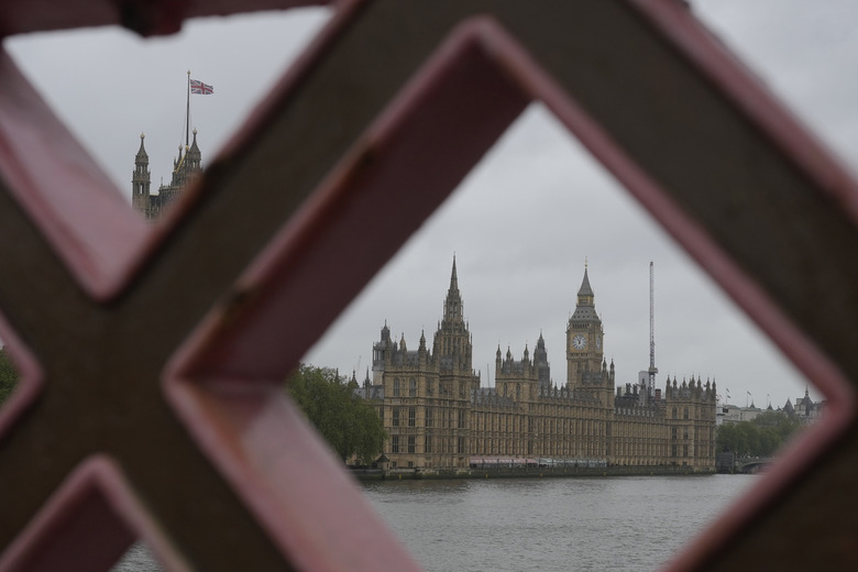 A general view of the Houses of Parliament from across the River Thames in London, Friday, May 3, 2024. Britain's governing Conservative Party is suffering heavy losses as local election results pour in Friday, piling pressure on Prime Minister Rishi Sunak ahead of a U.K. general election in which the main opposition Labour Party appears increasingly likely to return to power after 14 years. (AP Photo/Kin Cheung)