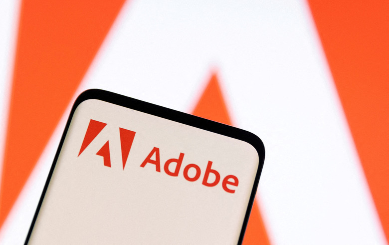 FILE PHOTO: FILE PHOTO: Adobe logo is seen on smartphone in this illustration taken June 13, 2022. REUTERS/Dado Ruvic/Illustration/File Photo/File Photo