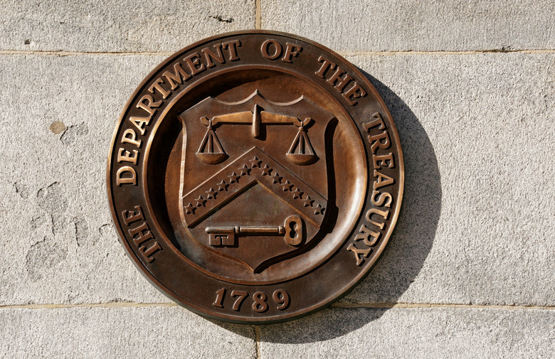 FILE PHOTO: A bronze seal for the Department of the Treasury is shown at the U.S. Treasury building in Washington, U.S., January 20, 2023. REUTERS/Kevin Lamarque/File Photo