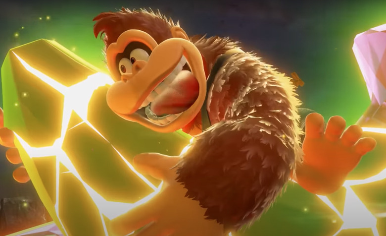 He's holding a giant gold banana.