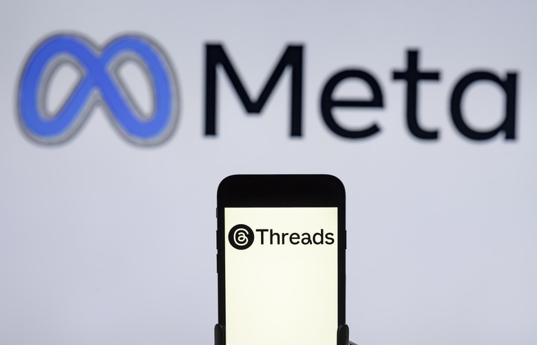 INDIA - 2024/02/12: In this photo illustration, the Threads logo is seen displayed on a mobile phone screen with Meta logo in the background. (Photo Illustration by Idrees Abbas/SOPA Images/LightRocket via Getty Images)