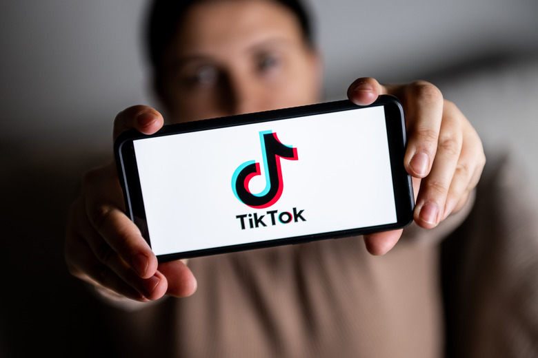 POLAND - 2023/01/06: In this photo illustration a TikTok logo is seen displayed on a smartphone. (Photo Illustration by Mateusz Slodkowski/SOPA Images/LightRocket via Getty Images)