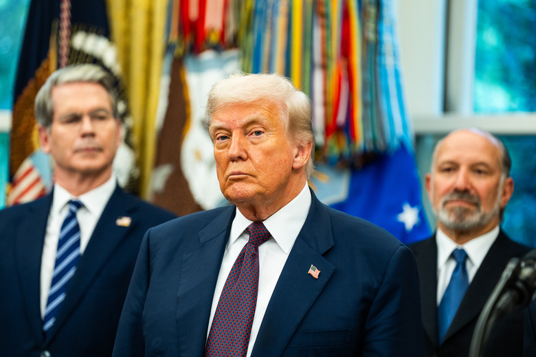 WASHINGTON, DC  August 6: CEO of Apple Tim Cook speaks during a meeting with US President Donald Trump in the Oval Office of the White House on Wednesday August 6, 2025. Apple announced a $100 billion investment in manufacturing facilities in the U.S. U.S. Vice President JD Vance, Secretary of Commerce Howard Lutnick and U.S. Treasury Secretary Scott Bessent were present. (Photo by Demetrius Freeman/The Washington Post via Getty Images)