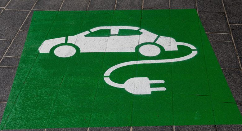 A carpet with an EV charging logo.