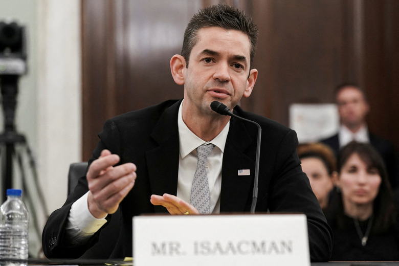 FILE PHOTO: Jared Isaacman, U.S. President Donald Trump's nominee to be administrator of the National Aeronautics and Space Administration (NASA) testifies during a Senate Commerce, Science, and Transportation confirmation hearing on Capitol Hill in Washington, D.C., U.S., April 9, 2025. REUTERS/Ken Cedeno/File Photo