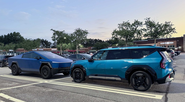 Two EVs — the Kia EV9 and Tesla Cybertruck — in a parking lot.