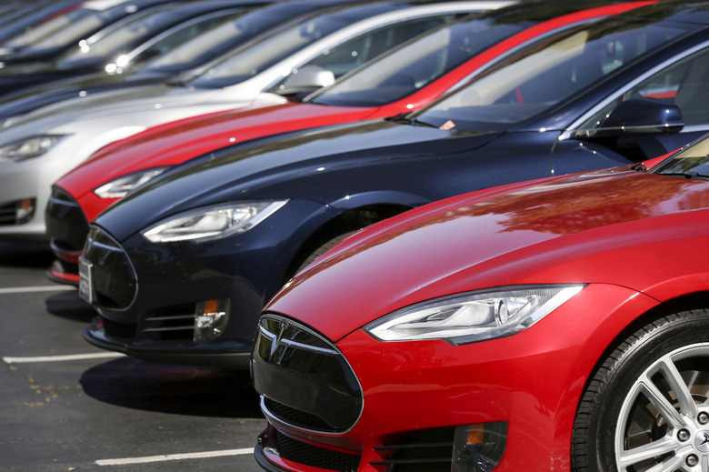 FILE PHOTO: A row of Tesla Model S sedans are seen outside the company's headquarters in Palo Alto, California April 30, 2015. REUTERS/Elijah Nouvelage/File Photo