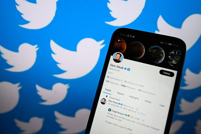 POLAND - 2023/07/17: In this photo illustration, Twitter Owner, Elon Musk's twitter account is displayed on a smartphone with Twitter logo on the background. (Photo Illustration by Omar Marques/SOPA Images/LightRocket via Getty Images)