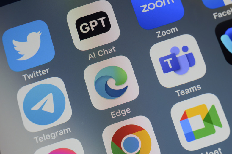 Close-up of of the icon of the Microsoft Edge artificial intelligence Internet browser app logo on a cellphone screen. Surrounded by the app icons of Twitter, ChatGPT, Zoom, Telegram, Teams, Chrome and Meet.