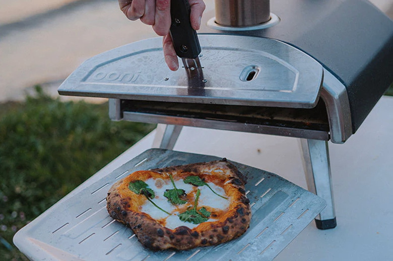A pizza oven with a pizza. Yum.