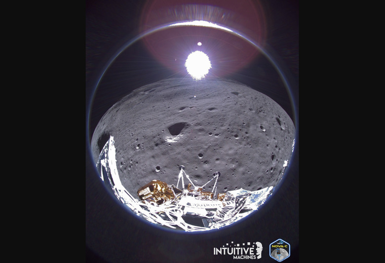 A wide angle view from the Odysseus moon lander showing a portion of the spacecraft, the moon, and Earth in the faraway distance