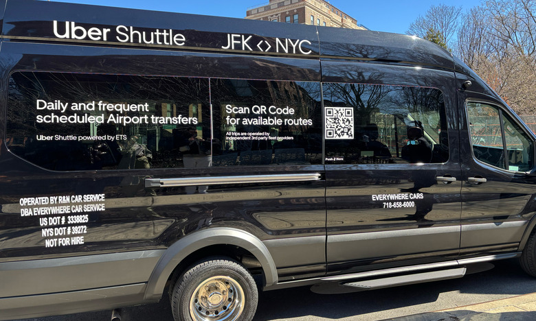 Photo of the side of an Uber Shuttle Bus running from JFK Airport to Manhattan.