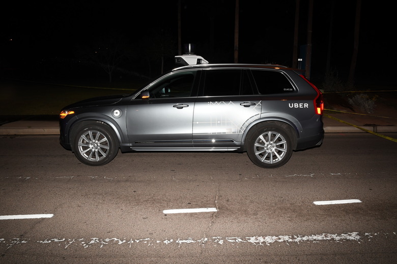 FILE - This file photo provided by the Tempe Police Department shows an Uber SUV after hitting a woman on March 18, 2018, in Tempe, Ariz. Nearly eight months after one of its autonomous test vehicles hit and killed an Arizona pedestrian, Uber wants to resume testing on public roads. The company has filed an application with the Pennsylvania Department of Transportation to test in Pittsburgh, and it has issued a lengthy safety report pledging to put two human backup drivers in each vehicle and take a raft of other precautions to make the vehicles safe. Company officials acknowledge they have a long way to go to regain public trust after the March 18 crash in Tempe, Arizona, that killed Elaine Herzberg, as she crossed a darkened road outside the lines of a crosswalk. (Tempe Police Department via AP, File)