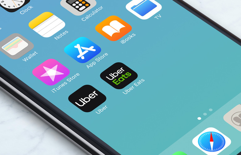 A computer render of a phone screen displaying the Uber and uber eats apps.