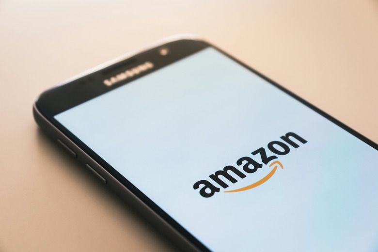 The Amazon logo on a smartphone.