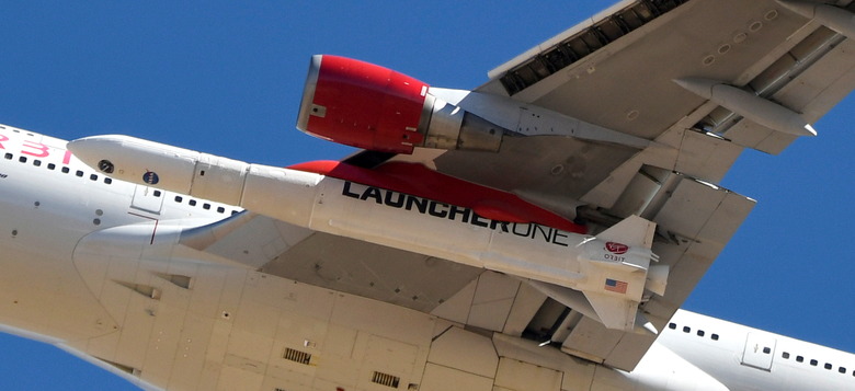 A view of Richard Branson's Virgin Orbit, with a rocket underneath the wing of a modified Boeing 747 jetliner, during test launch of its high-altitude launch system for satellites from Mojave, California, U.S. January 17, 2021.  REUTERS/Gene Blevins