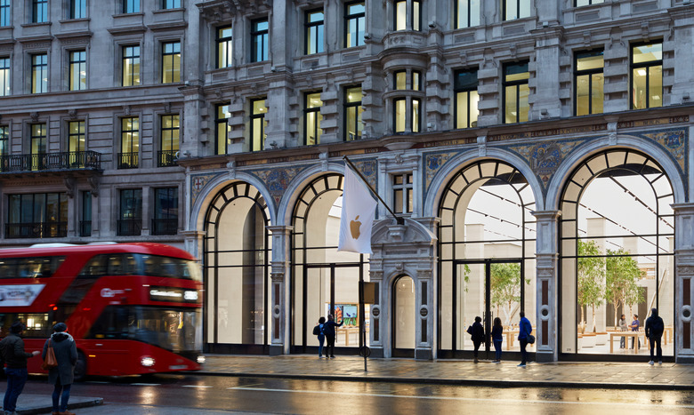 Photo of the front of the Apple Store in London on Regent St. A double-decker bus approaches.