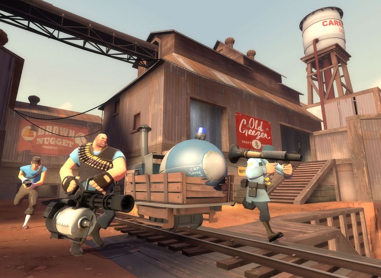 Team Fortress 2 screenshot showing a Blue scout, heavy and soldier moving a payload. 