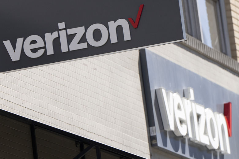 Signs are displayed outside a Verizon retail location on Tuesday, May 14, 2024, in Portland, Ore. (AP Photo/Jenny Kane)